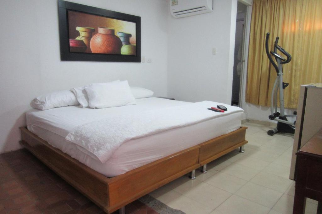 Postel nebo postele na pokoji v ubytování Hotel Nuevo Tio