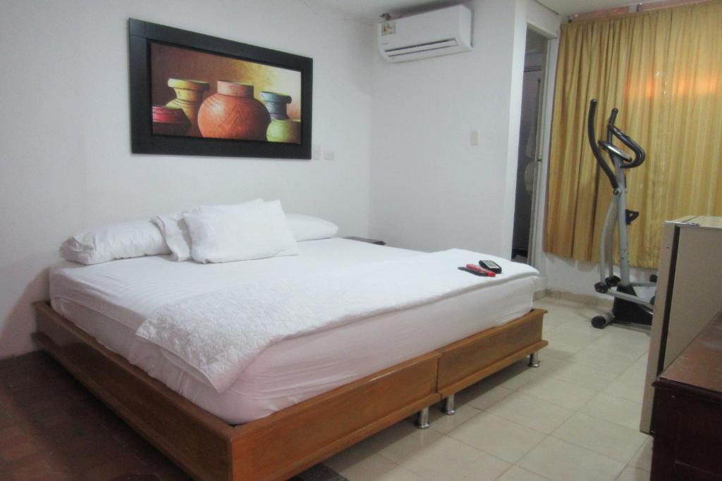 Postel nebo postele na pokoji v ubytování Hotel Nuevo Tio