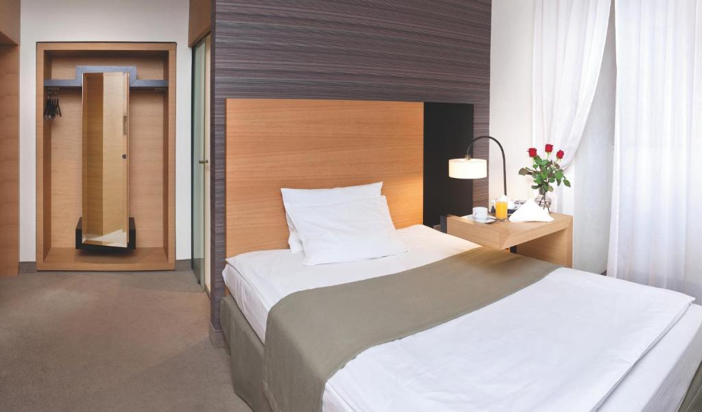 Postel nebo postele na pokoji v ubytování Hotel Bulwar