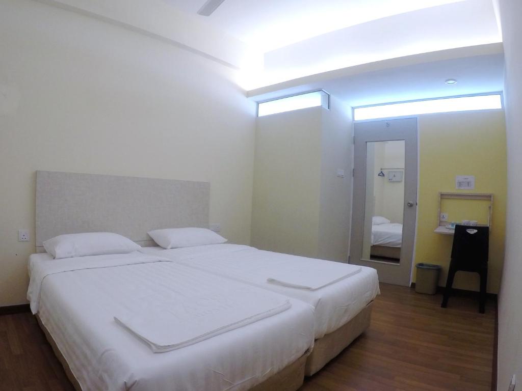 Postel nebo postele na pokoji v ubytování 1ACS Residence