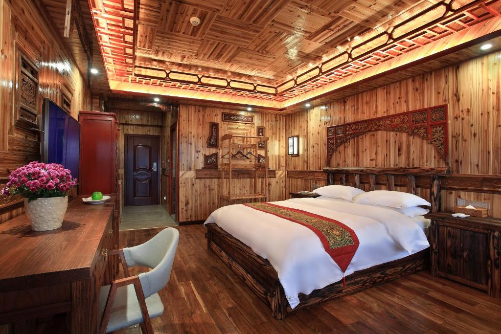 Postel nebo postele na pokoji v ubytování Baike Boutique Hotel