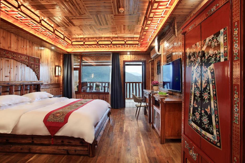 Postel nebo postele na pokoji v ubytování Baike Boutique Hotel