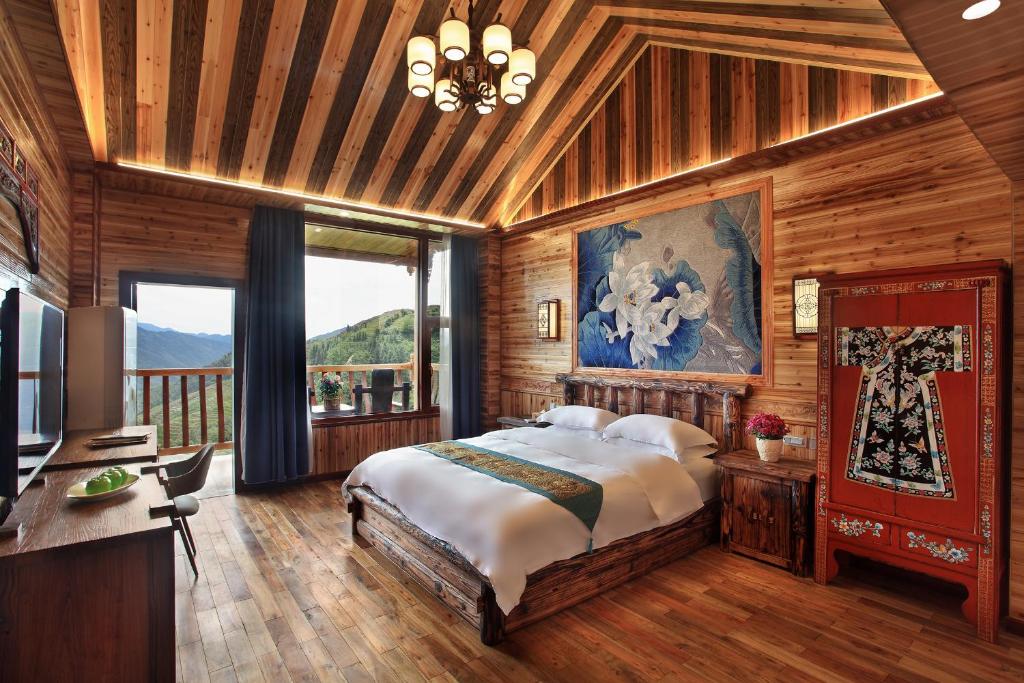 Postel nebo postele na pokoji v ubytování Baike Boutique Hotel