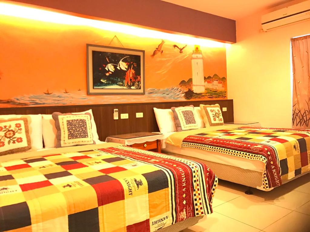 Ліжко або ліжка в номері Nan Wan KiKi Guesthouse