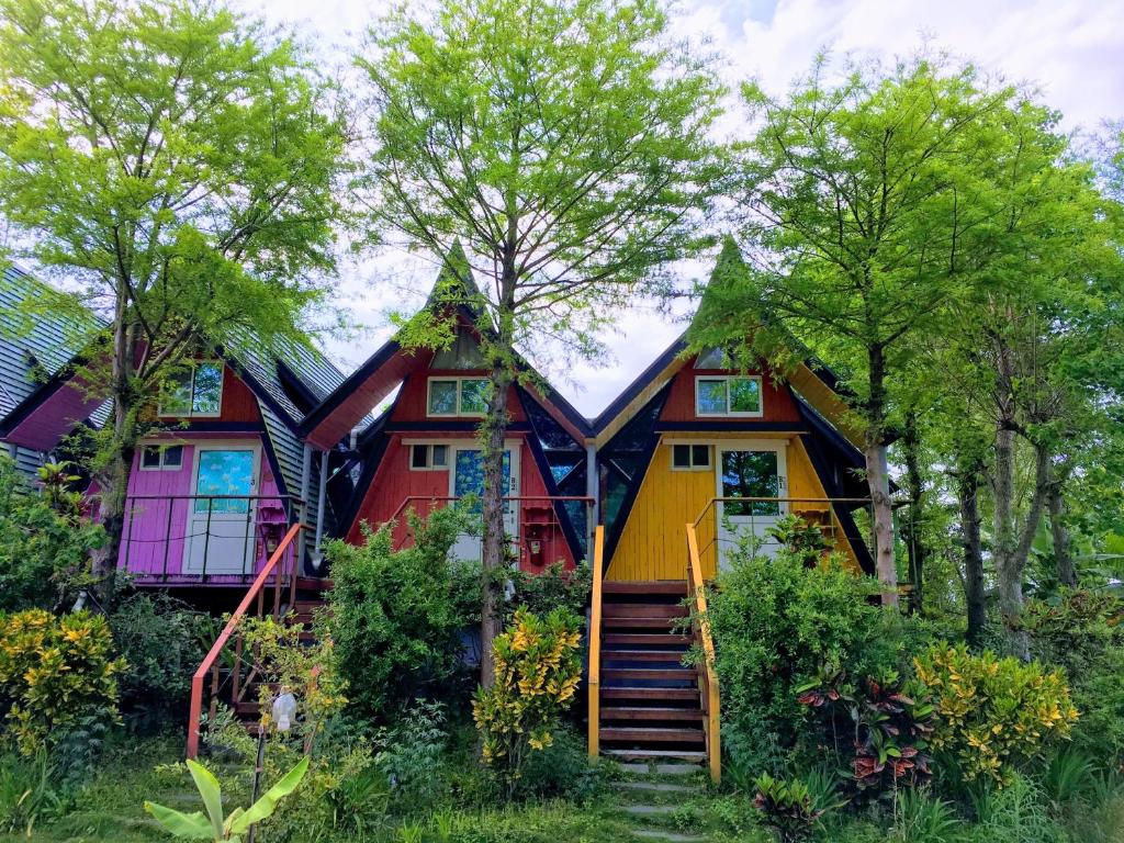 a colorful house with stairs in front of it at Kitefarm in Dongshan