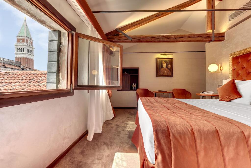 Postel nebo postele na pokoji v ubytování Hotel Donà Palace