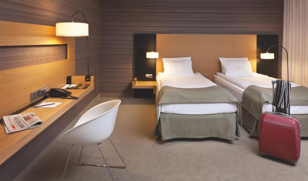 Postel nebo postele na pokoji v ubytování Hotel Bulwar