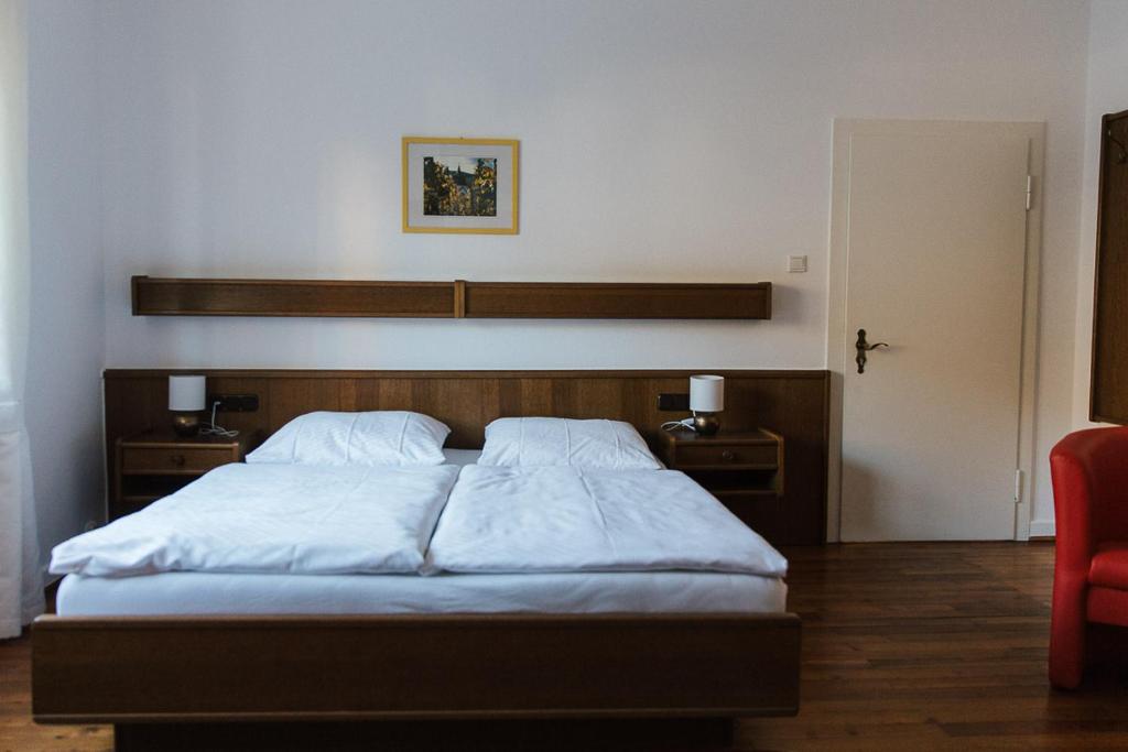 Postel nebo postele na pokoji v ubytování Galerie Riesling