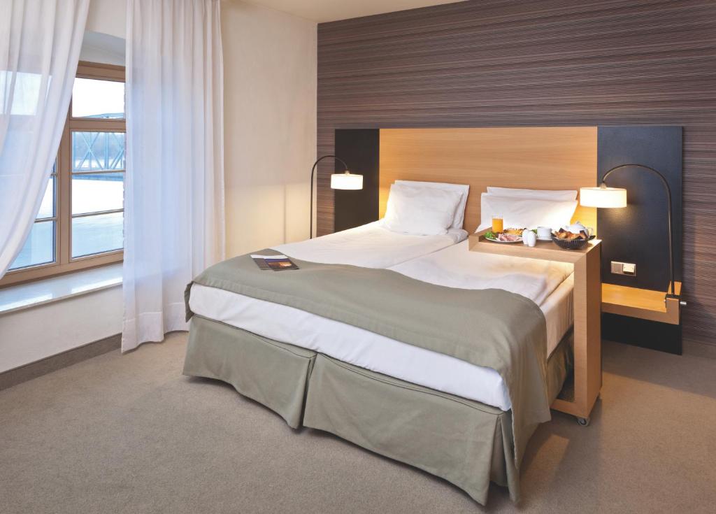 Postel nebo postele na pokoji v ubytování Hotel Bulwar