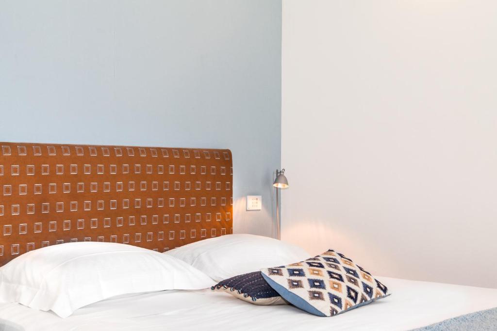Postel nebo postele na pokoji v ubytování Spluga Sosta & Hotel