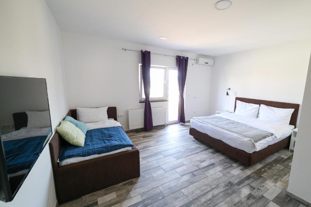 Postel nebo postele na pokoji v ubytování Guesthouse & restaurant Tekovina