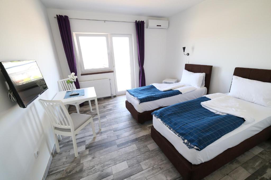 Postel nebo postele na pokoji v ubytování Guesthouse & restaurant Tekovina