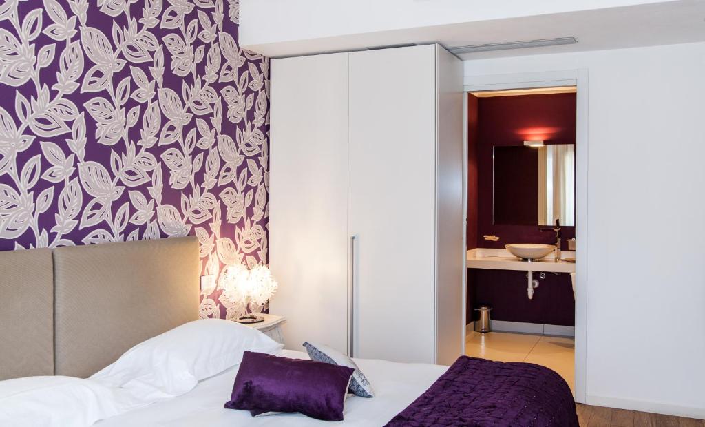 Postel nebo postele na pokoji v ubytování Spluga Sosta & Hotel