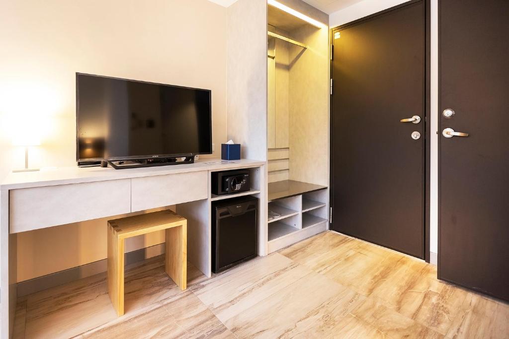 TV a/nebo společenská místnost v ubytování Greatt Hotel
