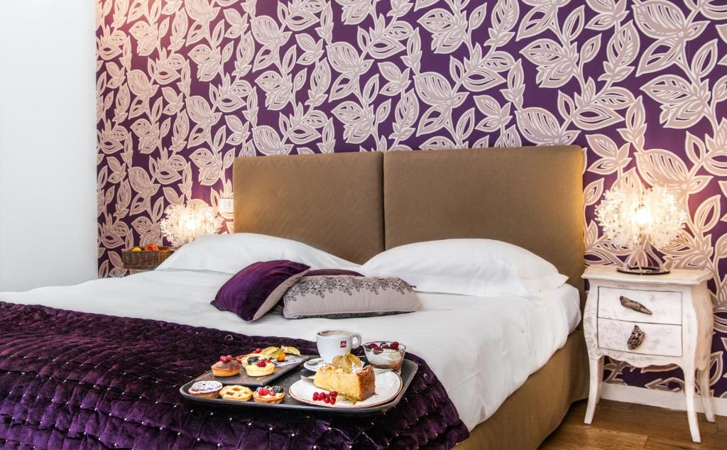 Postel nebo postele na pokoji v ubytování Spluga Sosta & Hotel