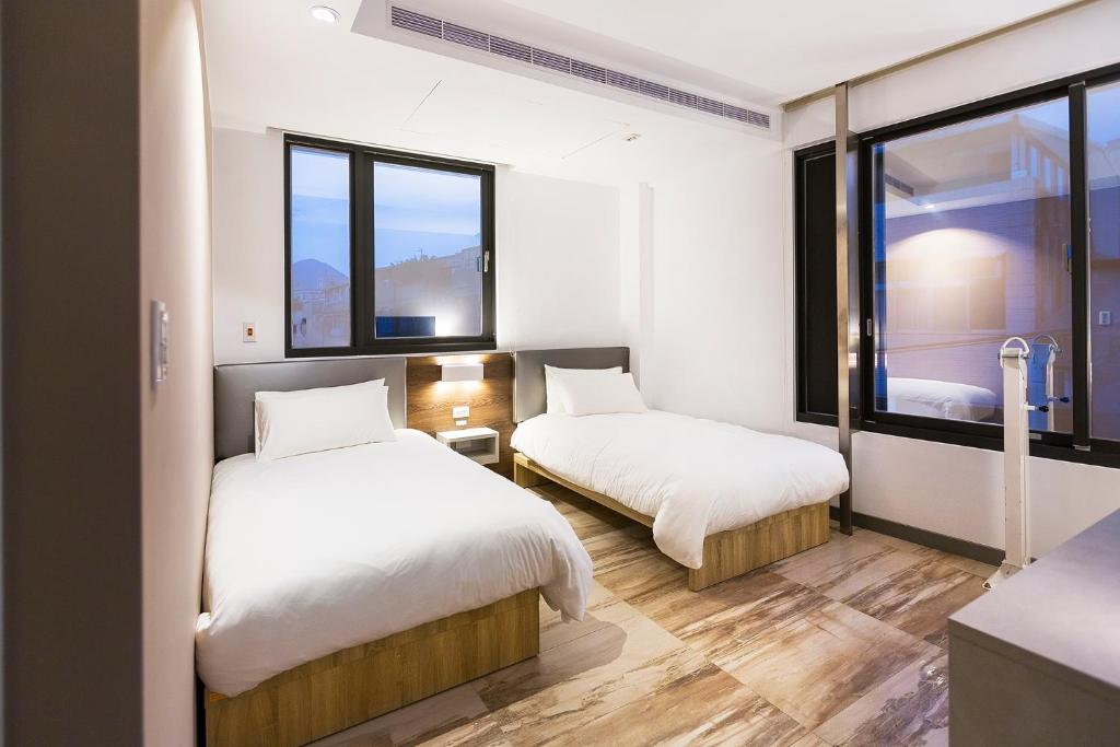Postel nebo postele na pokoji v ubytování Greatt Hotel