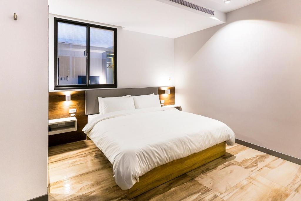 Postel nebo postele na pokoji v ubytování Greatt Hotel