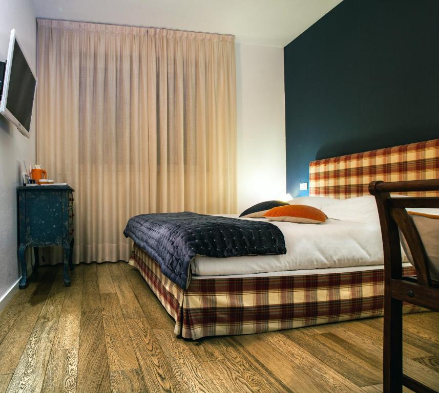 Postel nebo postele na pokoji v ubytování Spluga Sosta & Hotel