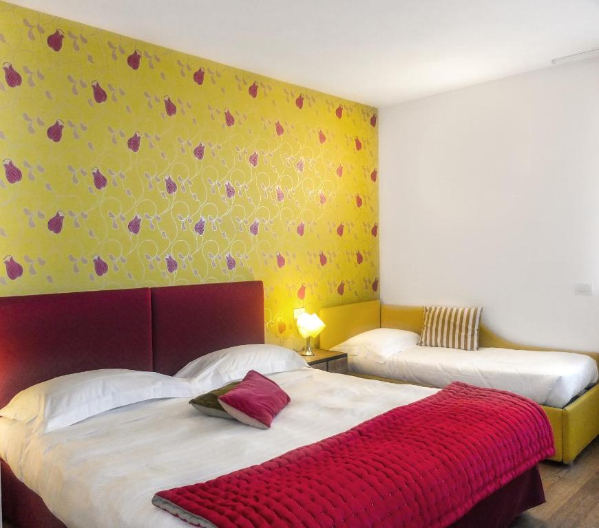 Postel nebo postele na pokoji v ubytování Spluga Sosta & Hotel