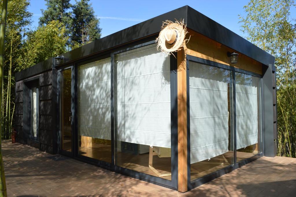 a black and white house with glass windows at Bamboo Guest House in Águeda