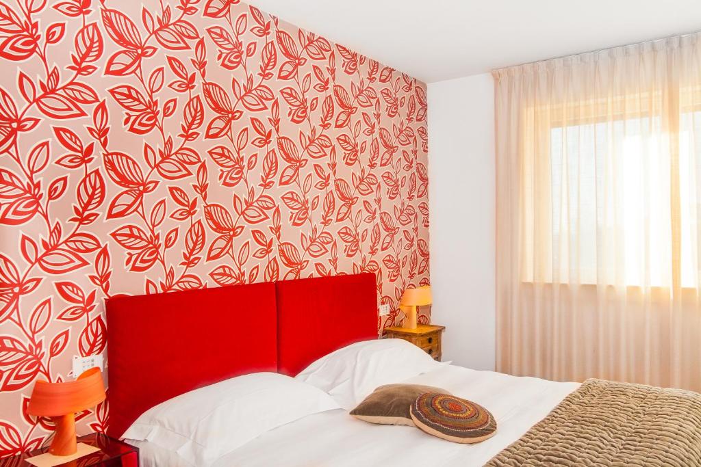 Postel nebo postele na pokoji v ubytování Spluga Sosta & Hotel