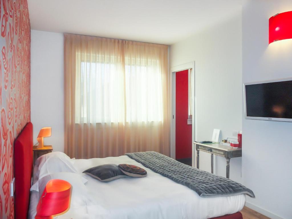 Postel nebo postele na pokoji v ubytování Spluga Sosta & Hotel