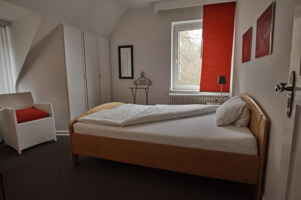 Postel nebo postele na pokoji v ubytování Hotel Burgfeld