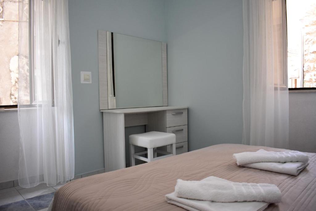 Postel nebo postele na pokoji v ubytování Lanterna Apartments