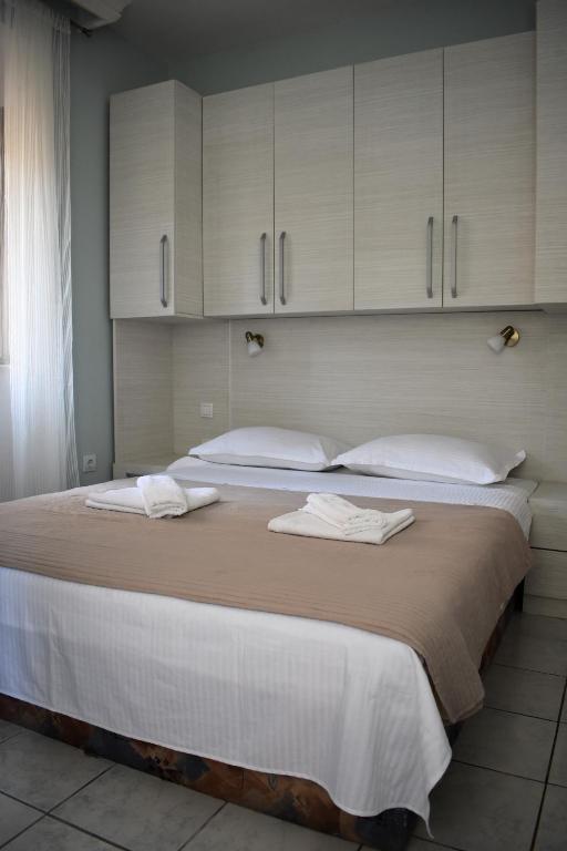 Postel nebo postele na pokoji v ubytování Lanterna Apartments