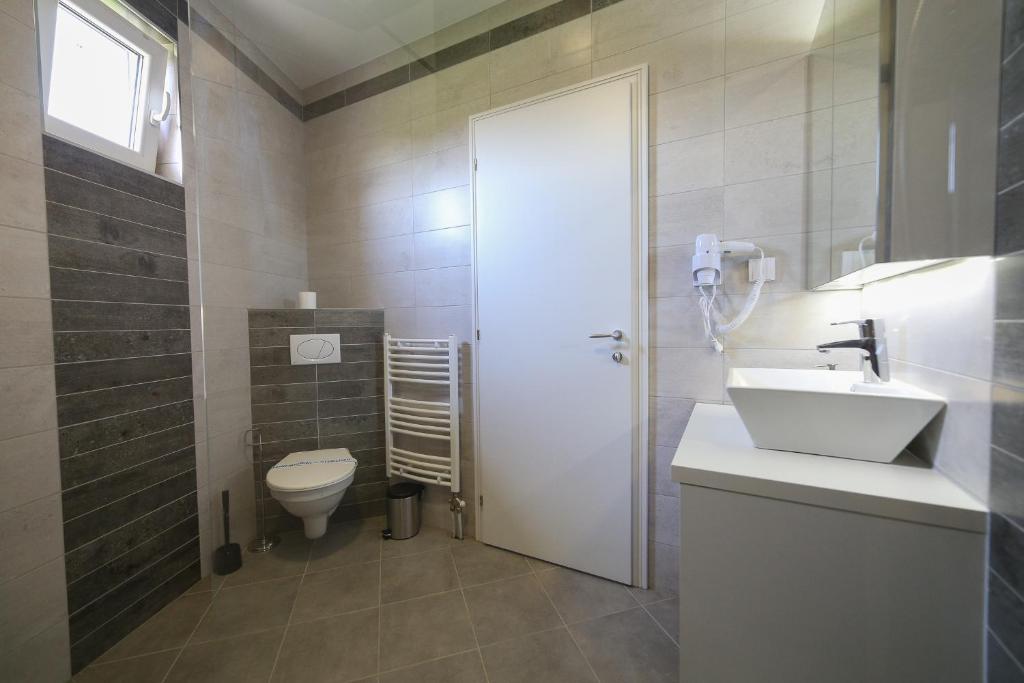 Koupelna v ubytování Guesthouse & restaurant Tekovina