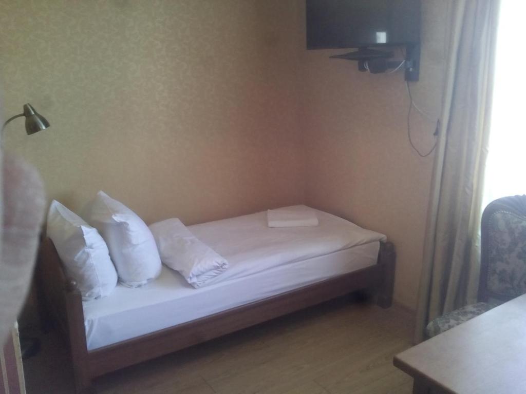 Postel nebo postele na pokoji v ubytování Sveciu Namai Avada