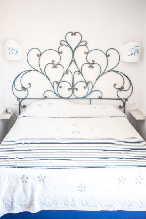 Postel nebo postele na pokoji v ubytování Olbia City Hotel
