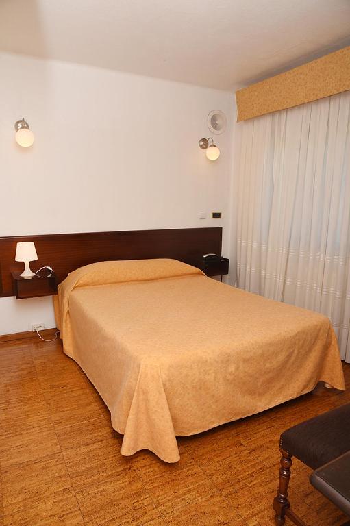 Postel nebo postele na pokoji v ubytování Hotel Val Flores