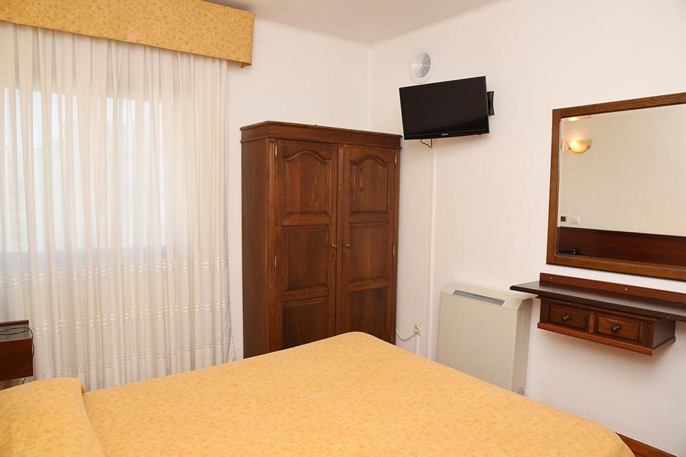 Postel nebo postele na pokoji v ubytování Hotel Val Flores