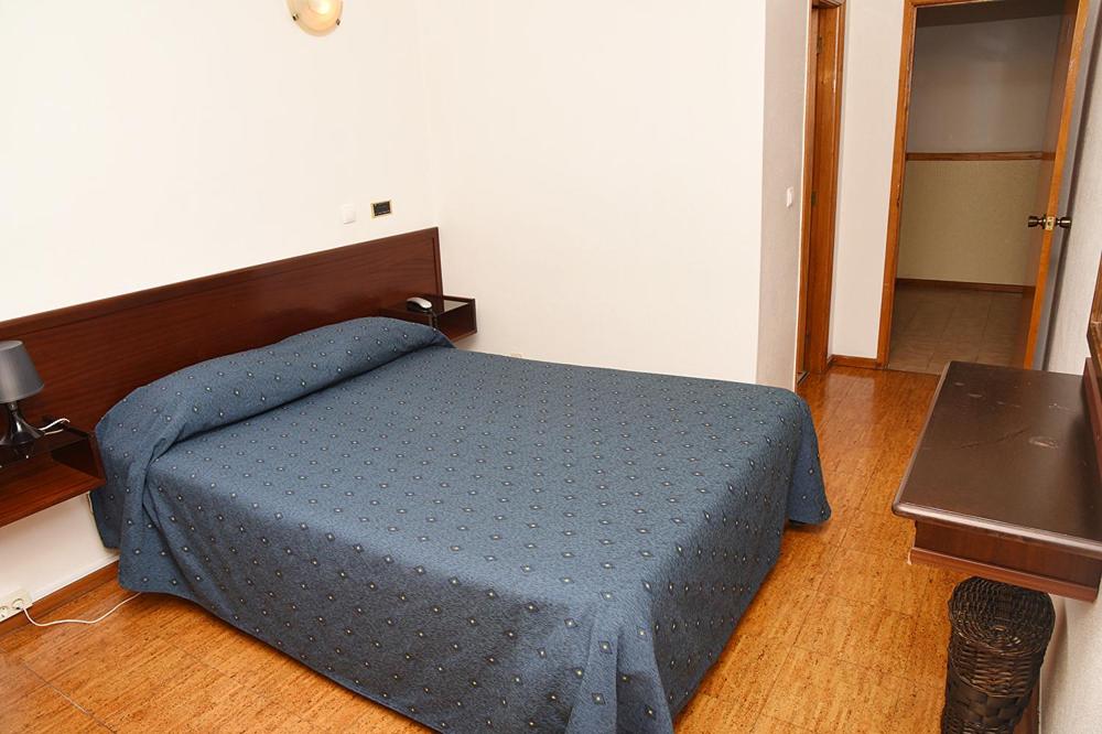 Postel nebo postele na pokoji v ubytování Hotel Val Flores