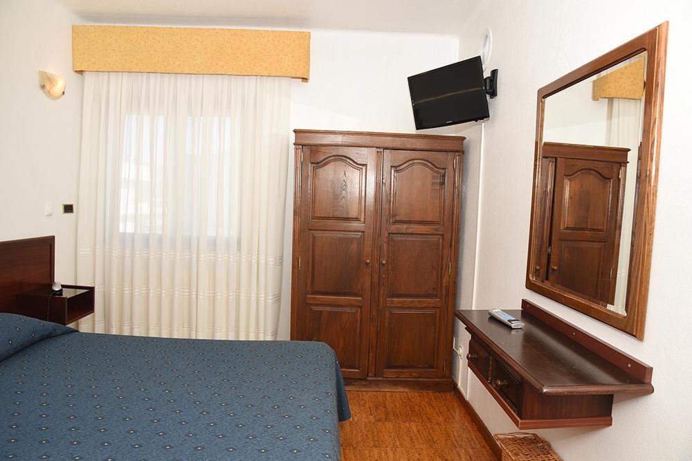 Postel nebo postele na pokoji v ubytování Hotel Val Flores