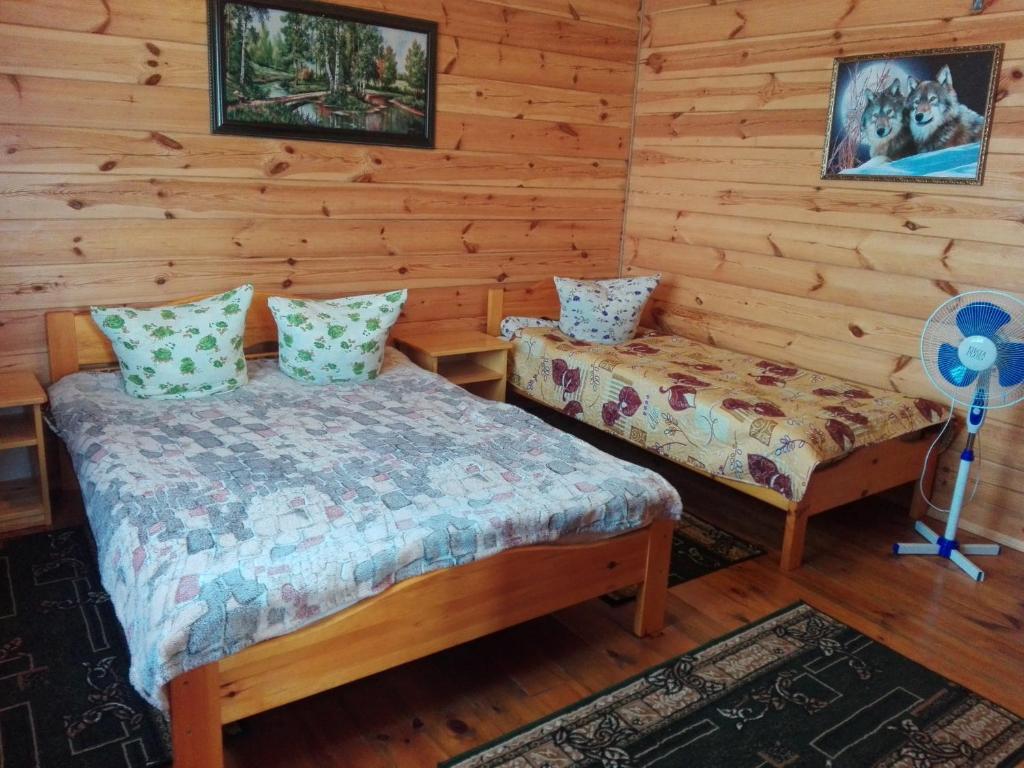 Postel nebo postele na pokoji v ubytování Лазурний берег