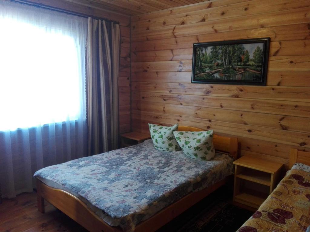 Postel nebo postele na pokoji v ubytování Лазурний берег