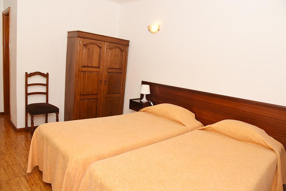 Postel nebo postele na pokoji v ubytování Hotel Val Flores