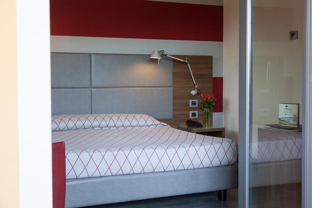 Postel nebo postele na pokoji v ubytování Hotel Del Parco