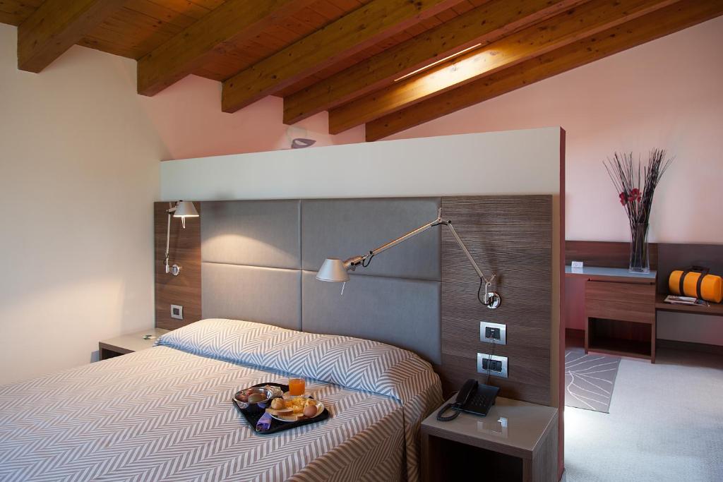 Postel nebo postele na pokoji v ubytování Hotel Del Parco