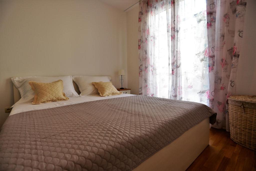 Posteľ alebo postele v izbe v ubytovaní Apartman Lucita
