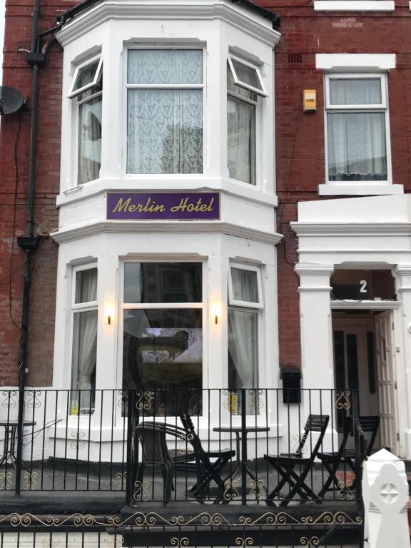 a building with a sign that reads melbourne hotel at The Merlin Hotel in Blackpool