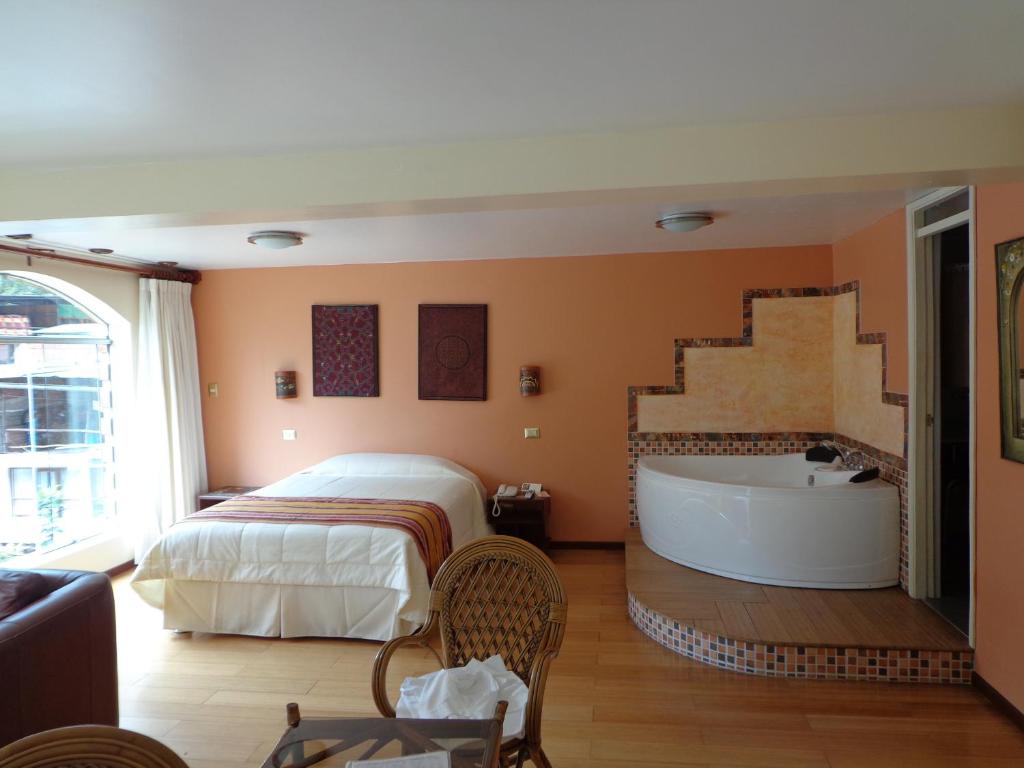 Postel nebo postele na pokoji v ubytování Hotel Taypikala Machupicchu