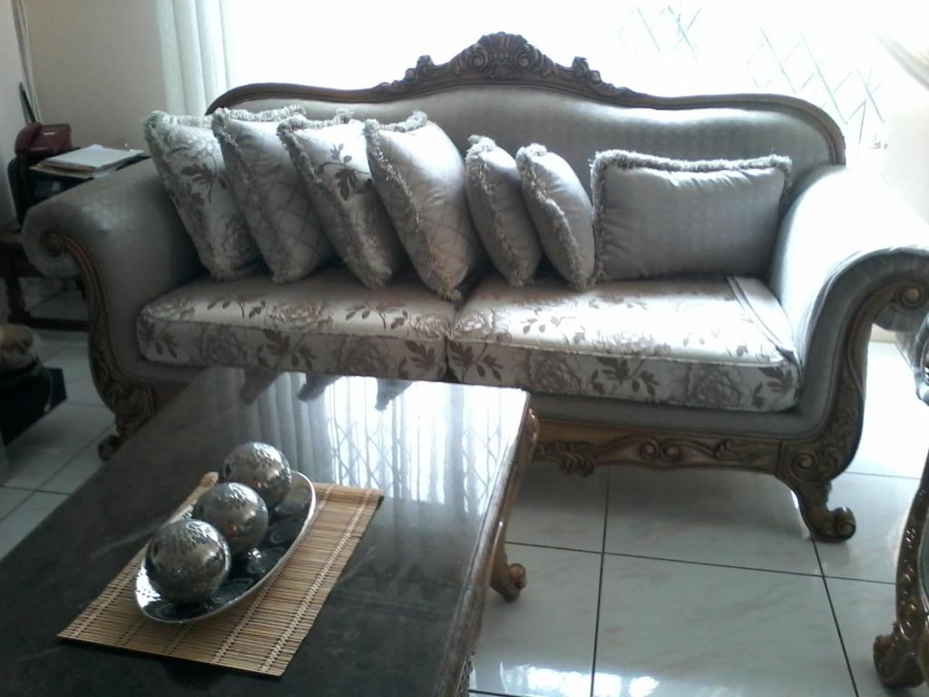 a living room with a couch and a table at Newlands East Home With A Beautiful View in Durban