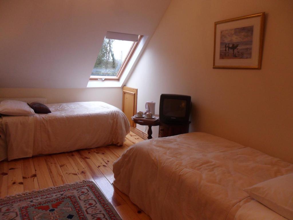 Postel nebo postele na pokoji v ubytování Forest Park House B&B
