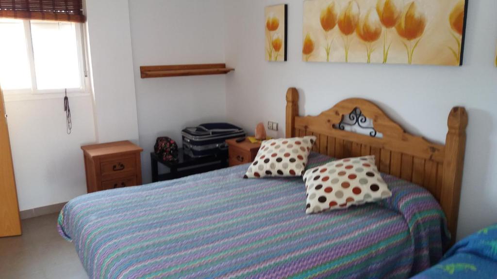 Postel nebo postele na pokoji v ubytování Casa Rural El Jardín del Hueznar