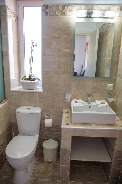 Koupelna v ubytování G&K Stone Suites