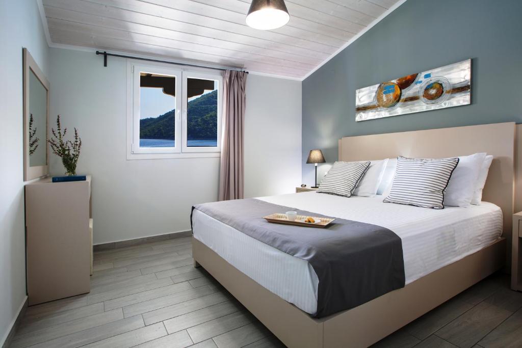 Posteľ alebo postele v izbe v ubytovaní Captain Nick Aparthotel