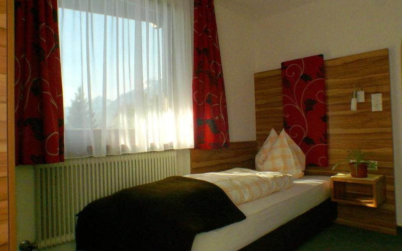Postel nebo postele na pokoji v ubytování Gasthof Pension Alpenblick